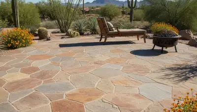 Flagstone patio installation with natural slate pavers and earth tones by Tucson AZ landscaping experts